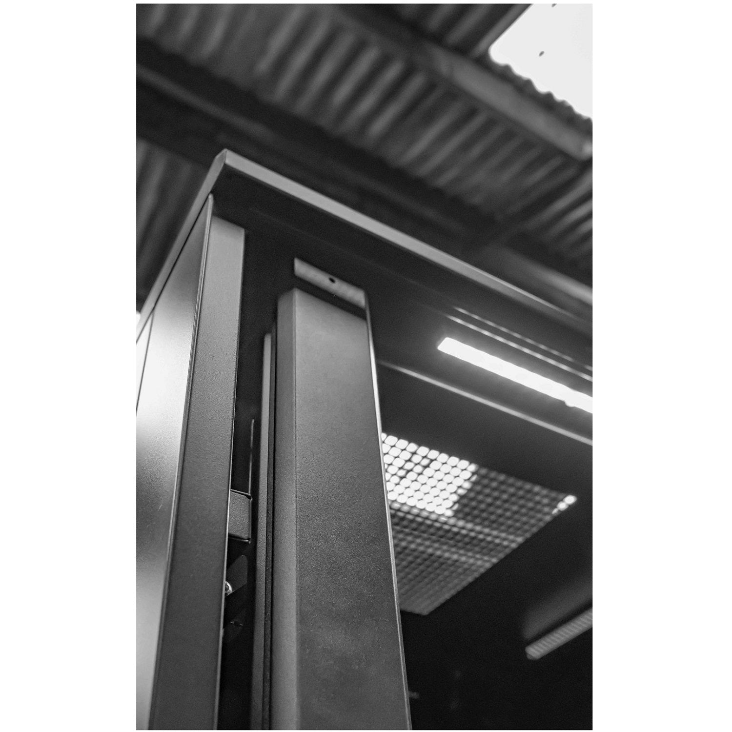 internal view of a 36U floor-standing data cabinet showing its vented-roof and internal lighting.