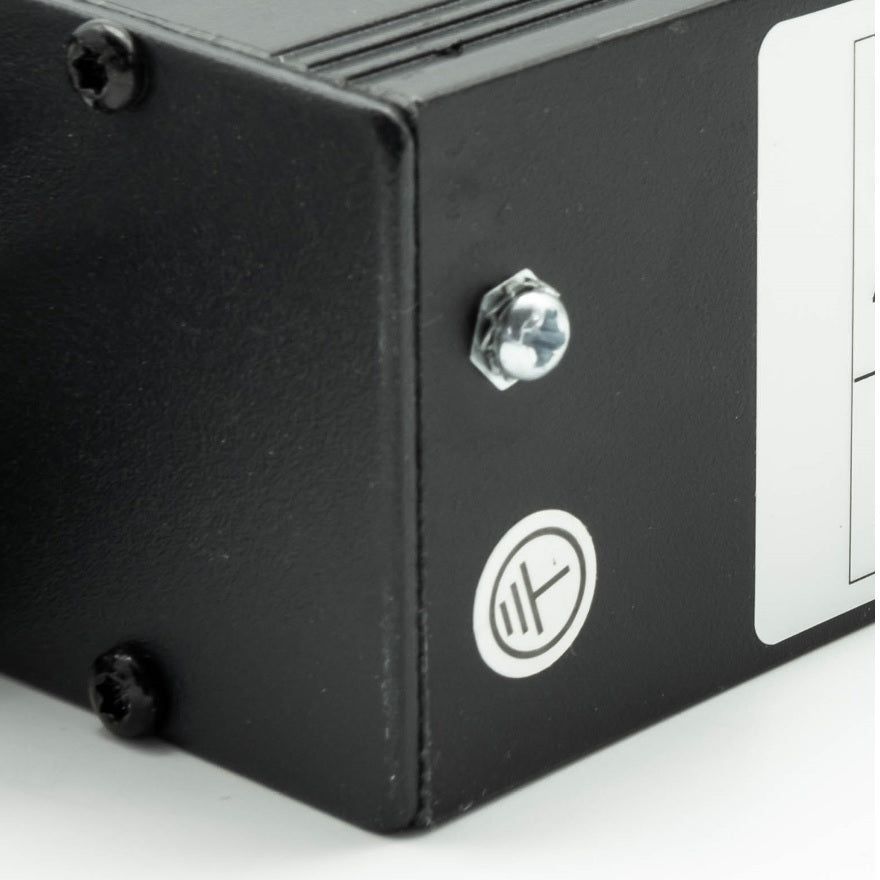 Right rear corner of a 1U 19" 6 Way Switched Horizontal UK 13A Sockets to 16A Commando Plug Rack PDU showing its grounding terminal in close-up view.
